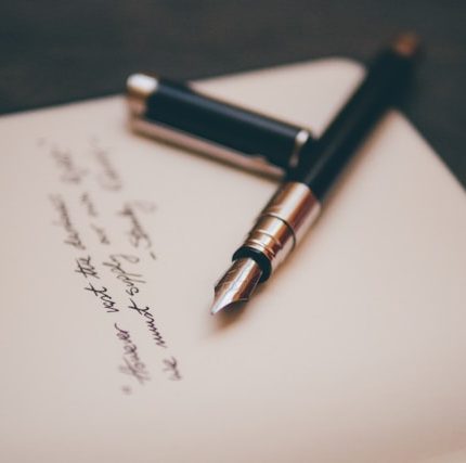 photo by Alvaro Serrano from Unsplash.com of a will with fountain pen lying on top